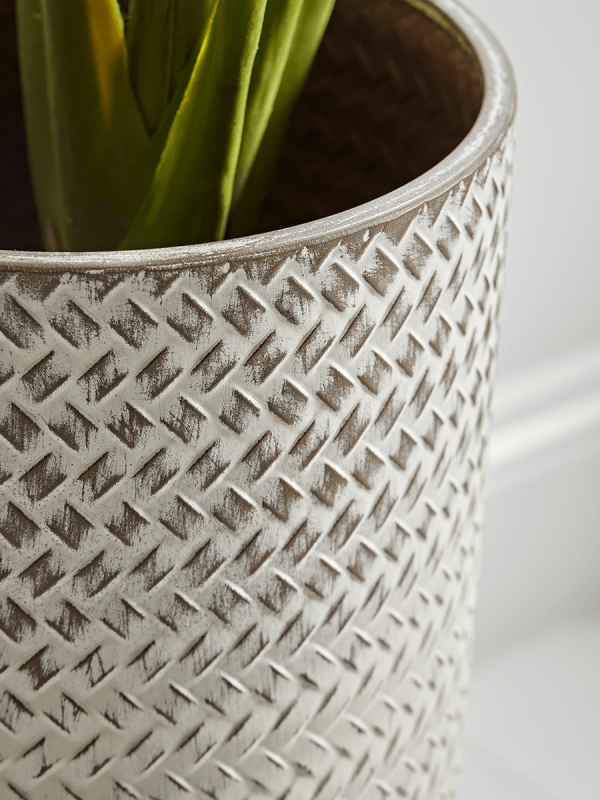 Our elegant cylindrical planters have a beautiful white wash finish and subtle embossed pattern detail. Available in a small and a large size our planters will make a real statement when displayed together - create life in a forgotten corner with a botanical feature, or position individually about the home to uplift the look of your planting.